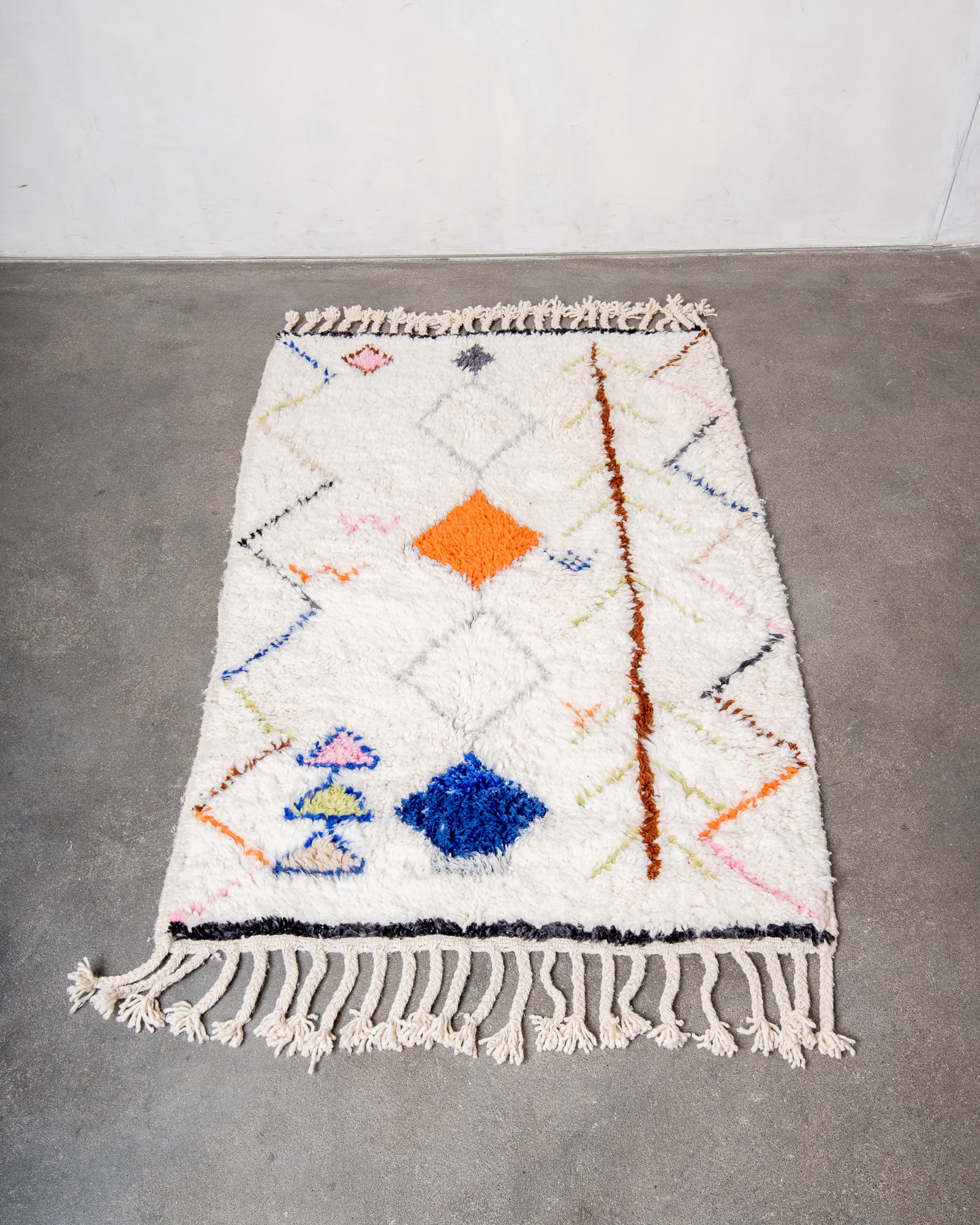 Modern, designer, handcrafted Berber rug from Morocco. Beniourain carpet with beautiful colours and patterns and fluffy wool texture.